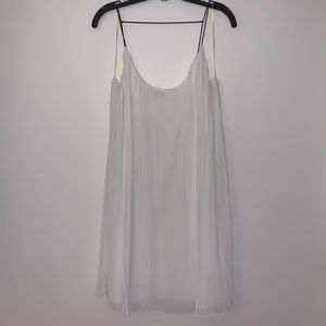 Pleated white cocktail dress with black straps